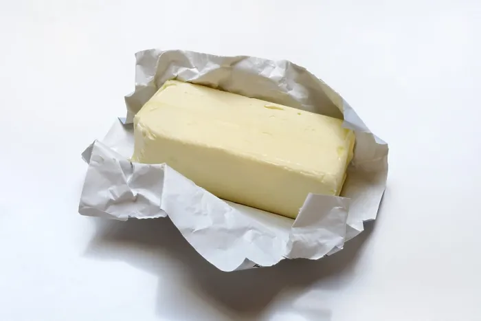 Stampa con cornice : Burro con imballaggio aperto.