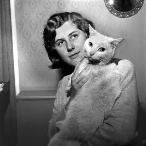 People with Animals Print: Woman Holding Cat, November 1969