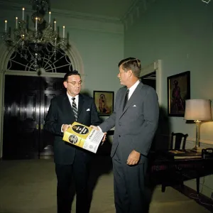 Print of Representative Edward Boland presenting Webster's Dictionary to President Kennedy