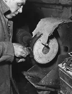 Industrial Worker Stampe: Buffing Handbag Frames