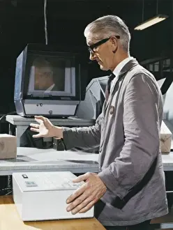 Historical Factory Images Stampe: Factory worker operating control box