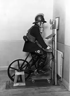 Historical Firefighting Images Stampe: Firefighter undergoing ergometer test