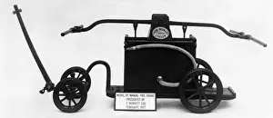 Vintage Firefighting Equipment Stampe: Model of an old manual fire engine