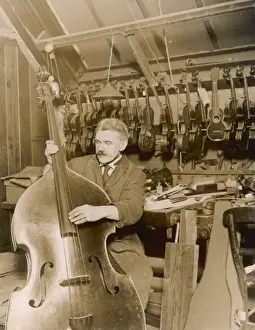 Stringed Instrument Maker Stampe: Stringed instrument maker in his workshop