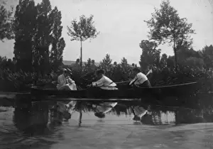 Physical Education History Stampe: Three students rowing