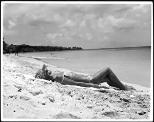 Woman In Bikini Stampe: Sunbathing on Sand