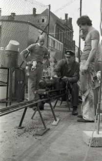Railway Transport Stampe: Train driver prepares engine on model steam train