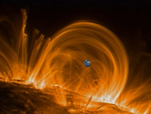 Stampe di I coroni solari. Immagine UV colorata del TRACE della struttura dei coroni sul Sole con la Terra sovrapposta per scala. Le basi delle loop sono le aree più calde (bianche) Immagini datate 2000: Circuiti coronalici solari