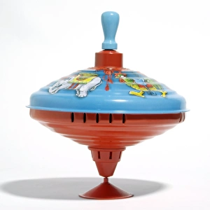 Stampe di La toppa da spinino gioca musica quando viene spinta tirando la maniglia blu (la testa della toppa) su e poi lasciandola cadere verso il suo posto di partenza Immagini datate 2008 novembre: Top a rotazione