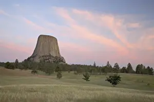 Cloudy Sky At Dusk Stampe: Devils Tower at sunset, Devils Tower National Monument, Wyoming