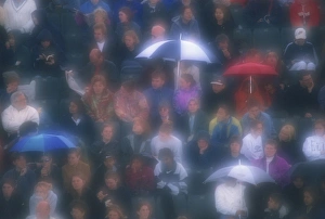 London Rain Stampe: Diffuser filter used on shot of Wimbledon crowd in the rain, London, England