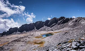 Spanish Mountain Scenery Stampe: Dramatic rugged mountain range with a lake