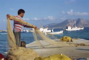 Greek Island Life Style Stampe: Fisherman sorting his nets