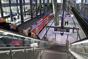 Subway Stations In Europe Stampe: Moving train pulling into modern train station, Berlin, Germany, Europe