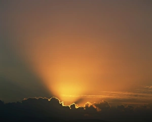 Outdoor Travel Images Stampe: Rays of light bursting out of dark clouds