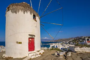 European Vacation Spots Stampe: View of whitewashed windmill overlooking town, Mykonos Town, Mykonos, Cyclades Islands