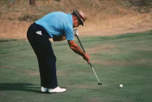 Golfing Legends Of The 70s Stampe: Sam Snead demonstrating his split-grip, side-saddle putting technique