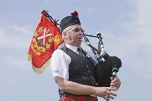 Traditional Scottish Music Stampe: A bagpipe player
