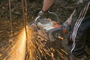 Construction Worker Equipment Stampe: a builder using an angle grinder