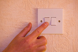 Electricity Supply Stampe: flicking a light switch