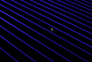 Total Lunar Eclipse Stampe: The moon is seen during the beginning of a total lunar eclipse through the structures of