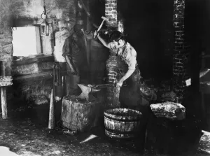 19th Century Occupations Stampe: BLACKSMITH AT WORK. A blacksmith and assistant at work. Undated photograph