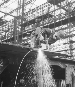German Armed Forces Stampe: Workman Using Welding Tool
