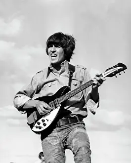 George Harrison Guitar Stampe: Performing
