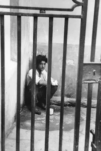 Isolated Male Figure Stampe: Behind Bars