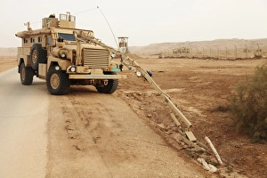 Middle East Military Operations Stampe: A MRAP vehicle disassembles an improvised explosive device