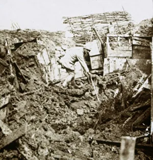 WWI Black And White Pictures Stampe: Aftermath of a shell, a soldier in the crater, c1914-c1918