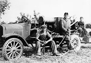 Vintage Farm Equipment Images Stampe: Farmworkers with a tractor, (c1930s?)