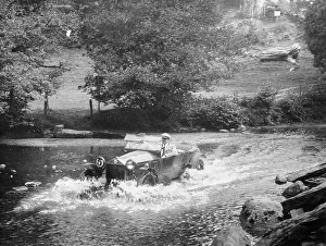 Black And White Car Images Stampe: A Lancia Lambda being driven through water, c1925