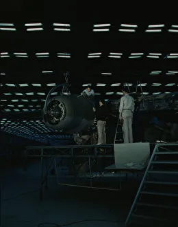 Second World War Aviation History Stampe: Lowering an engine in place in assembling