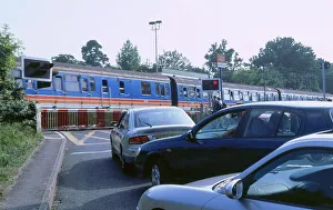 Road Transport Images Stampe: Traffic queue at level crossing in Brockenhurst, Hampshire