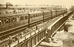 Black And White Train Images Stampe: A Train Passing Over The Bridge, c1930. Creator: Unknown