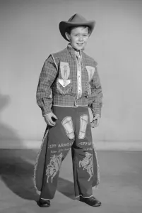 Vintage Fancy Dress Costumes Stampe: Boy dressed as cowboy Jeff Arnold for a Reveille feature on dressing up 2nd December