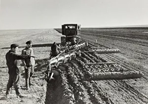 Farming Scene Stampe: A field is mechanically cleared