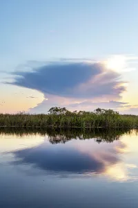 Blue Hour Reflections Stampe: Unusual cloud formation exploding over wetlands