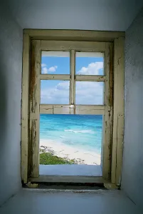 Latin America Coastal Scenery Stampe: Beach viewed from a window of a lighthouse, Punta Celarain Lighthouse, Cozumel, Mexico