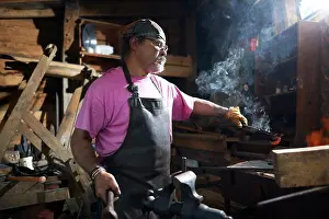 Blacksmith At Work Stampe: Blacksmith working in his forge