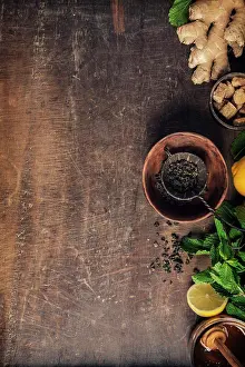 Herbal Tea Ingredients Stampe: Tea composition on rustic background: tea, mint, lemon, ginger. Flat lay top view