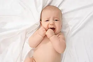Caucasian Child Portrait Stampe: Top view of child crying while looking at camera