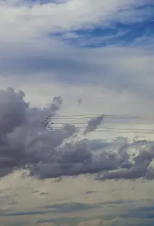 Aerial Display Stampe: Aerobatic jets soar through a dramatic