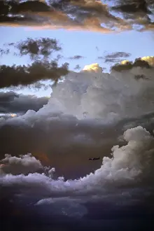 Passenger Plane Photography Stampe: Airplane in front of a cloud