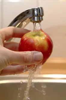 Healthy Dessert Ideas Stampe: An apple being washed