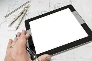 Construction Site Planning Stampe: Architech working on blank computer tablet
