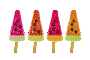 Studio Shot Dessert Stampe: Four assorted fruit popsicles isolated on a white background
