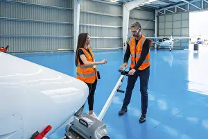 Aircraft Maintenance Stampe: Aviation engineers collaborating