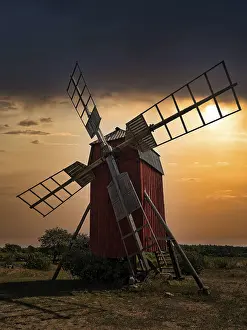 Dramatic Scandinavian Landscape Stampe: Backlit trestle windmill, dramatic evening sky
